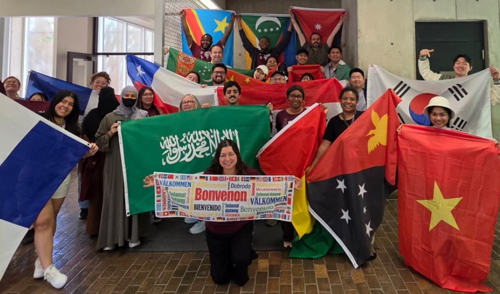 students holding up flags for different countries