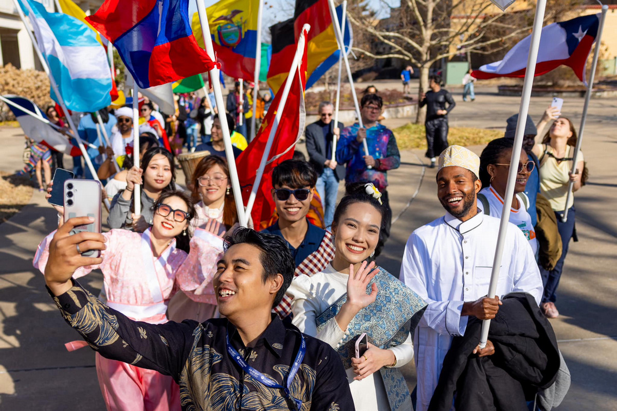 happy students at the parade of flags